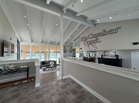 The image shows the interior of a furniture store named McComber Creek.